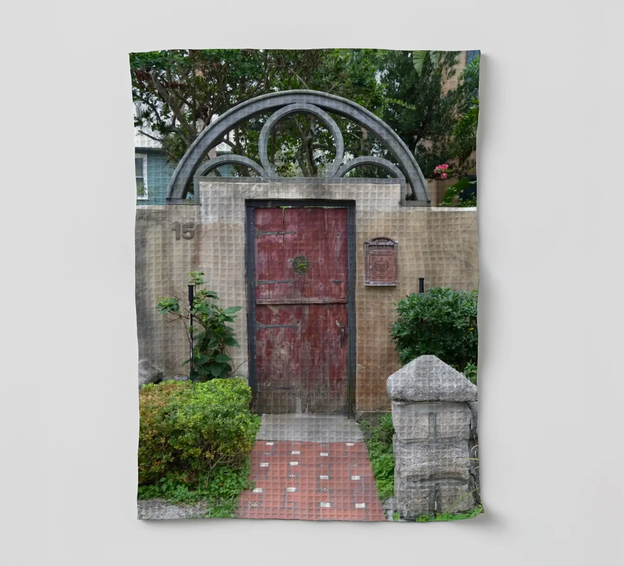 Charming Stone Wall and Wooden Door in St. Augustine tea towel by byrieneke