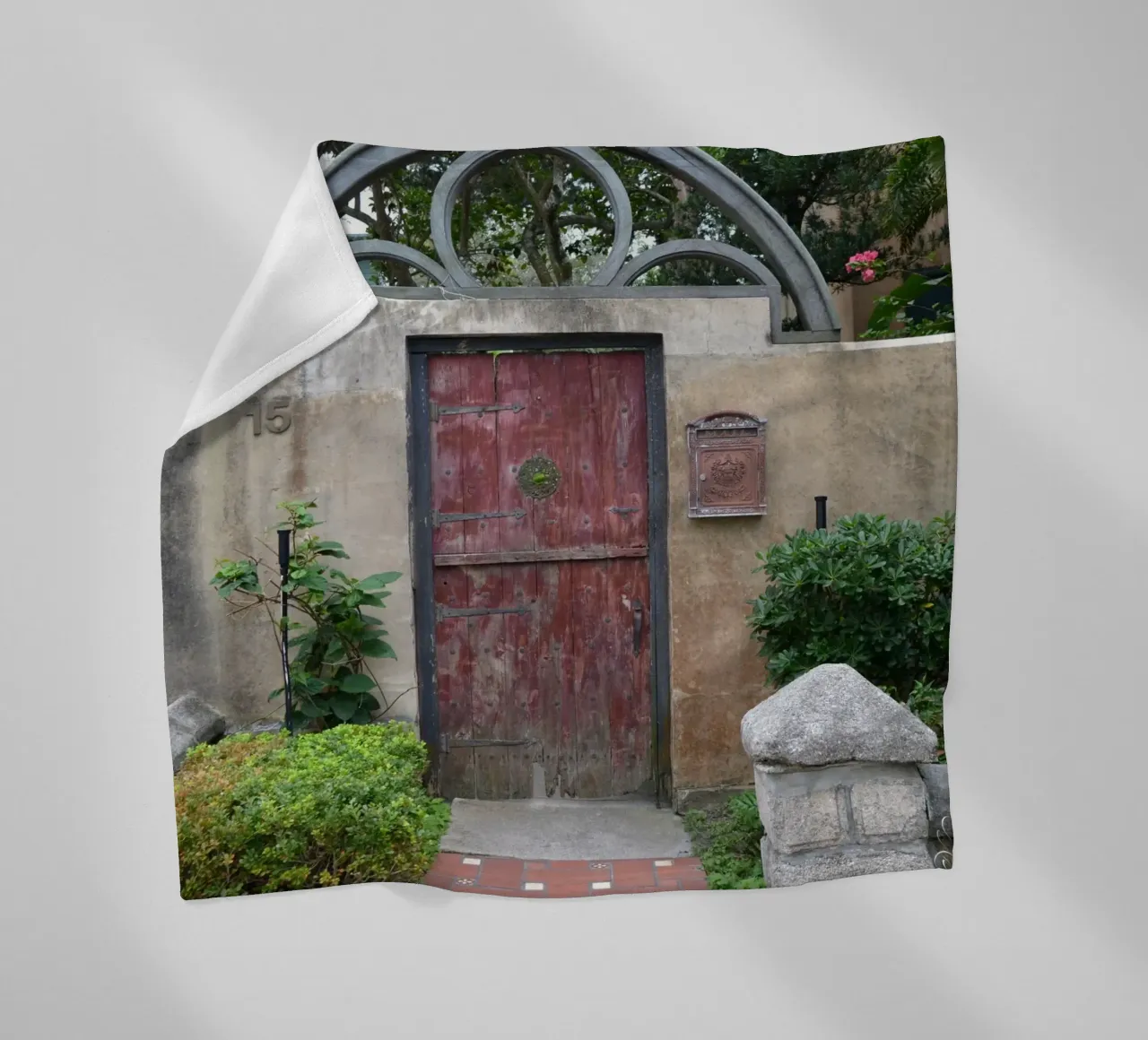 Charming Stone Wall and Wooden Door in St. Augustine fleece blanket by byrieneke