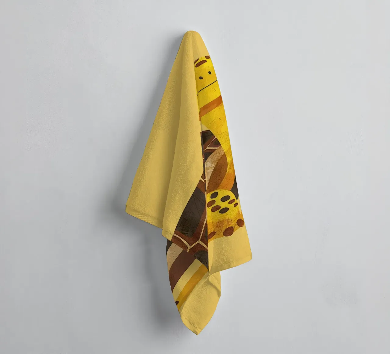 Turtle with a cheerful expression on a bright yellow art towel by DesignDoodle