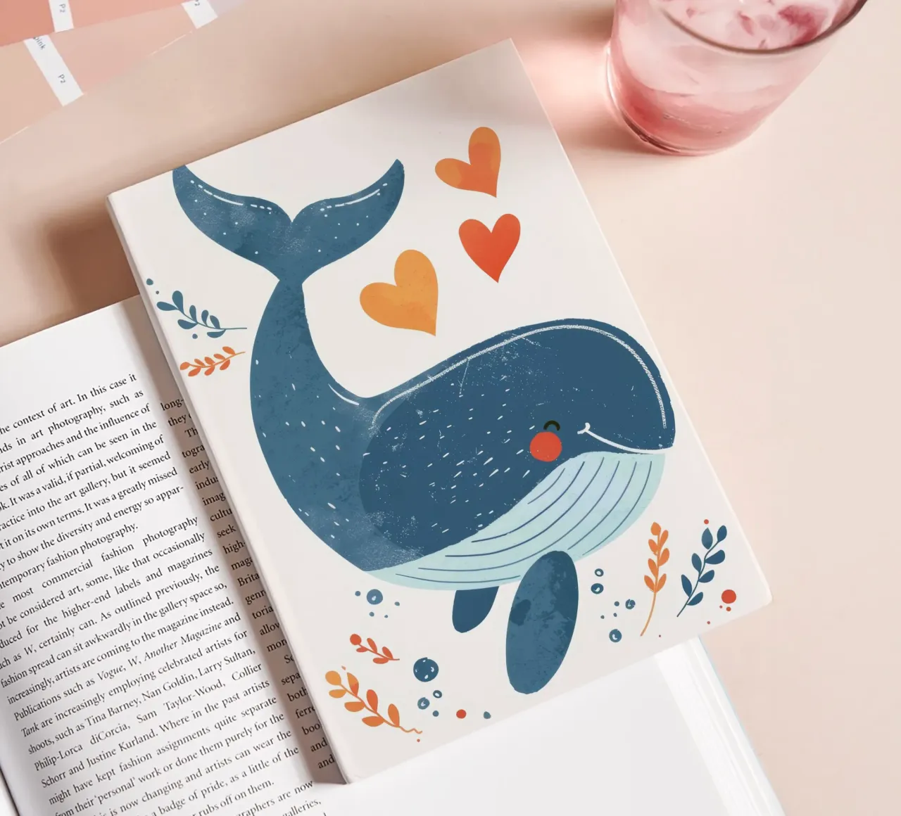 Joyful whale surrounded by hearts & plants in playful art notebook by DesignDoodle