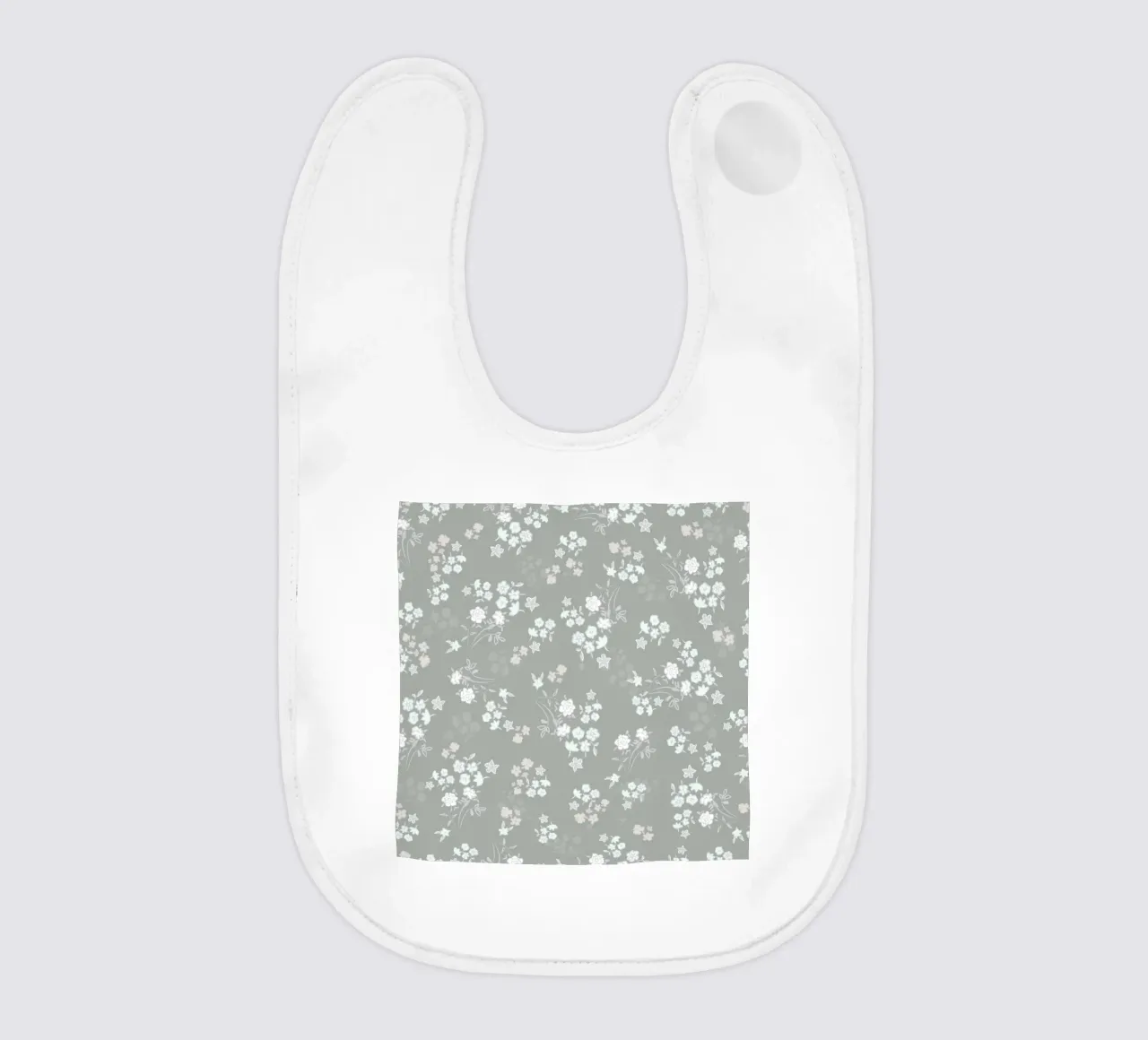 White ditsy pattern with green background baby bib by gulsengunel