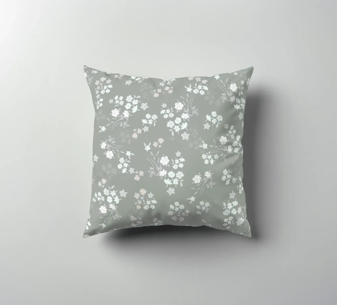White ditsy pattern with green background decorative cushion by gulsengunel