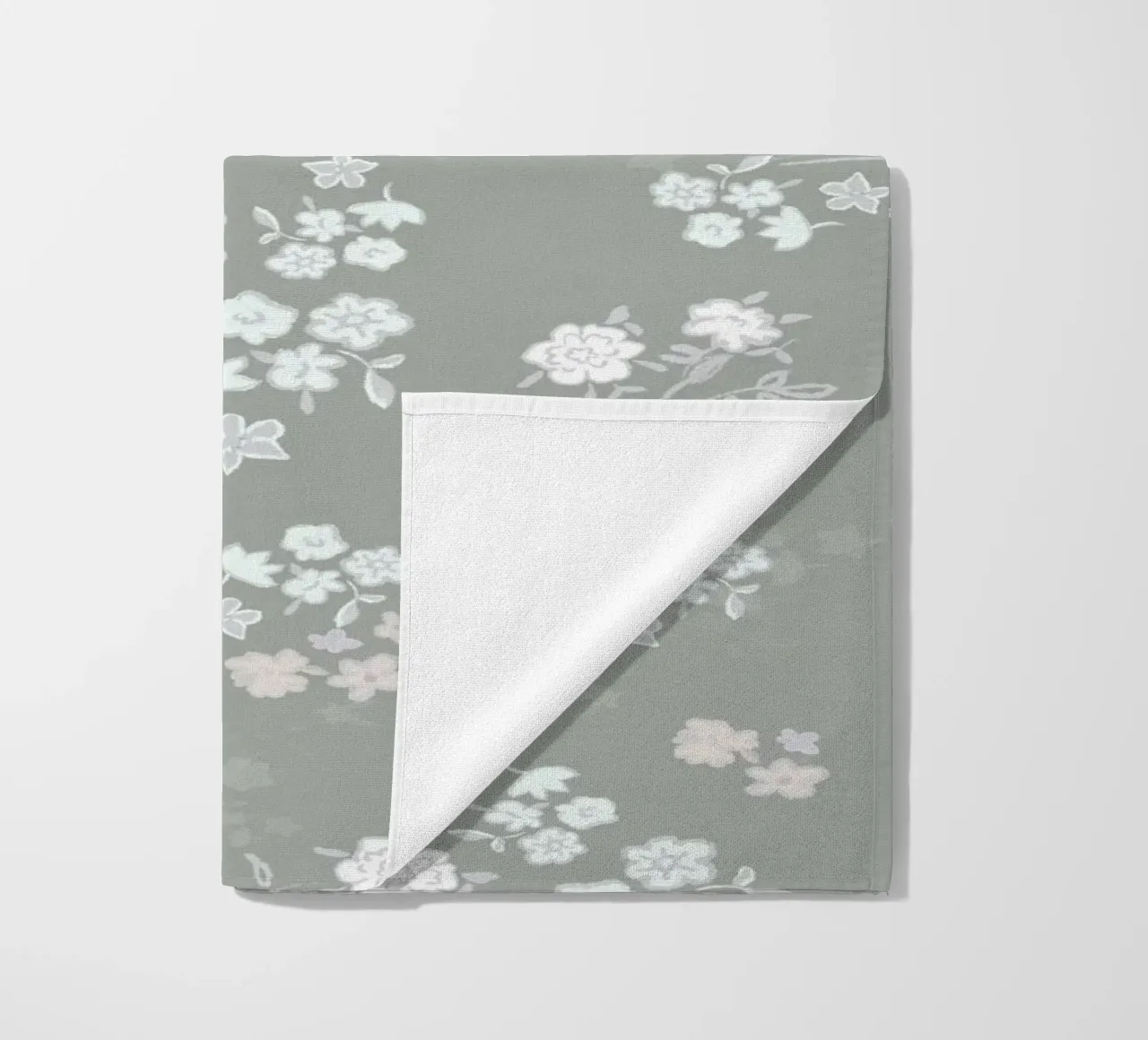 White ditsy pattern with green background beach towel by gulsengunel
