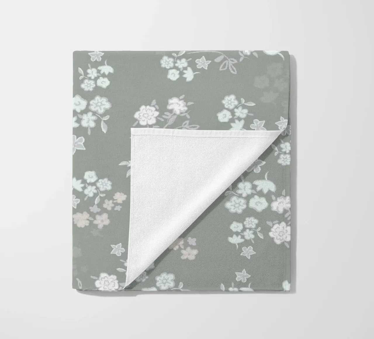 White ditsy pattern with green background beach towel by gulsengunel