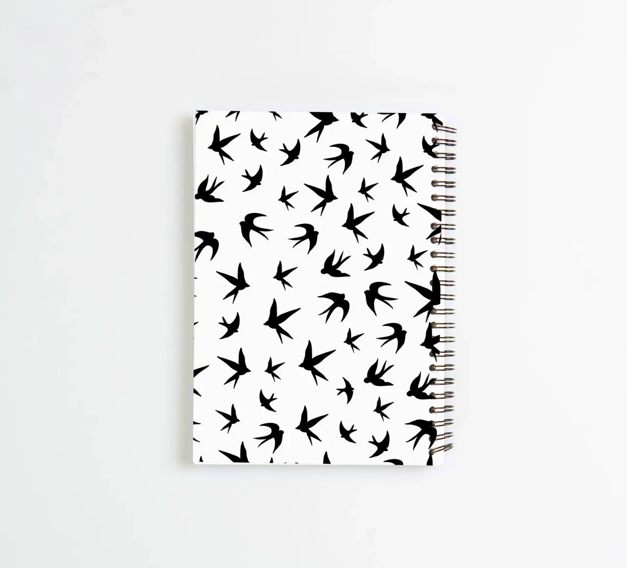 Zwaluwen vogels zwart silhouet op witte achtergrond notitieboek met spiraal van gulsengunel