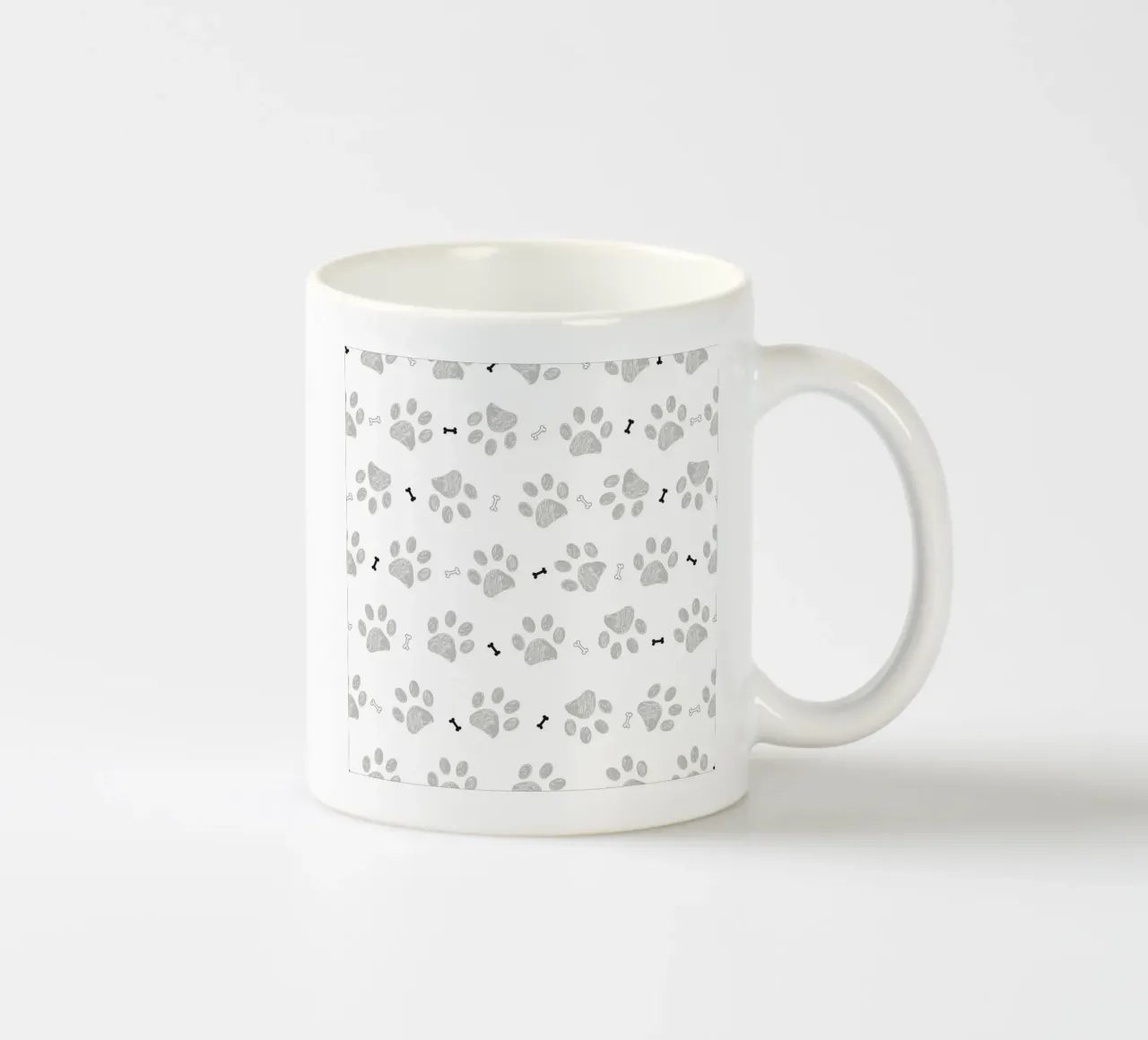Grey doodle paw prints with bones pattern ceramic mug by gulsengunel