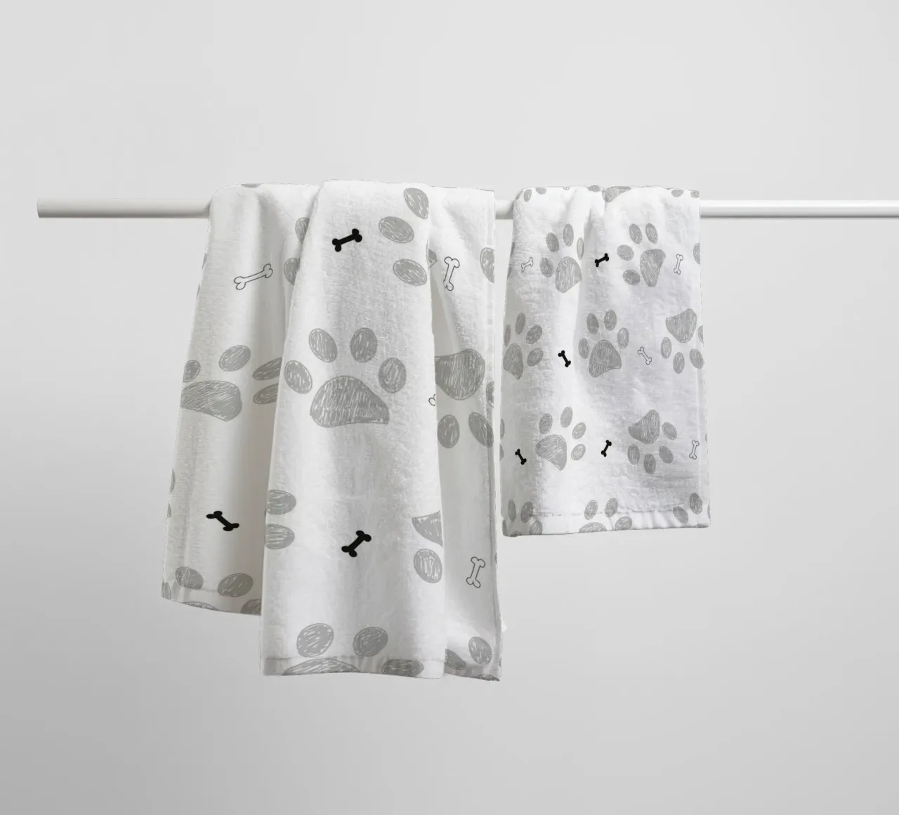 Grey doodle paw prints with bones pattern towel by gulsengunel