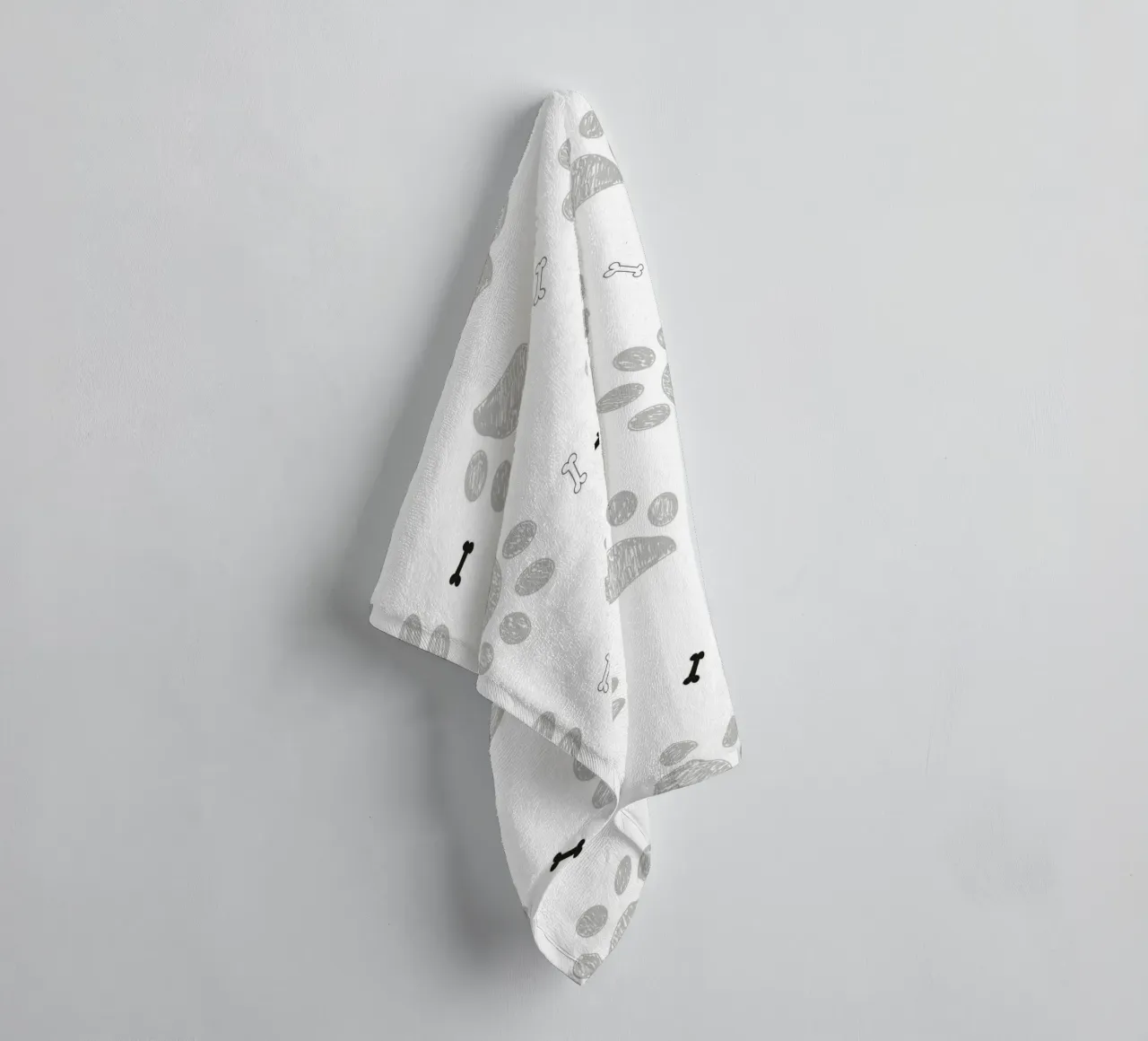 Grey doodle paw prints with bones pattern towel by gulsengunel