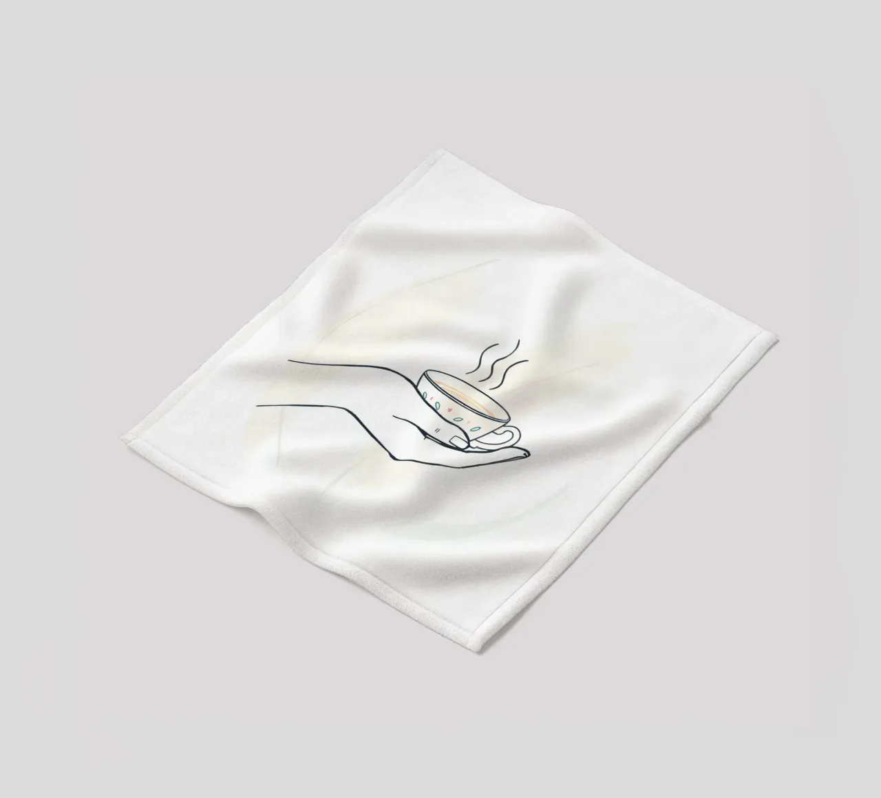 Hand holding a steaming cup of tea against a soft background fleece blanket by DesignDoodle