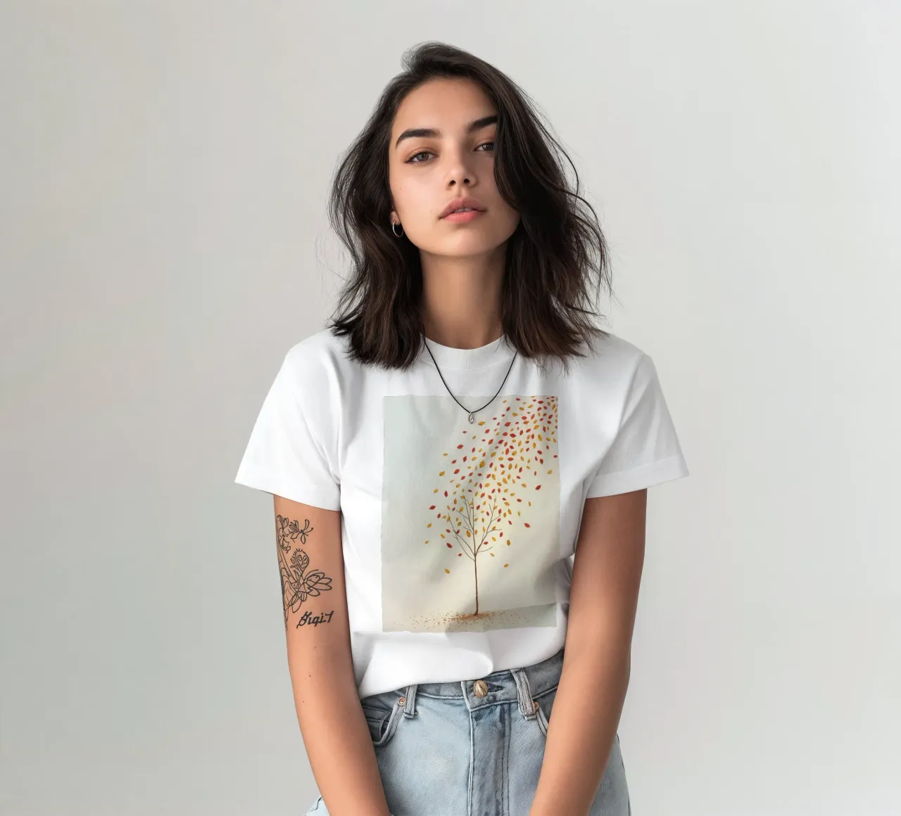Tree shedding leaves in autumn depicting the seasonal change t-shirt by DesignDoodle