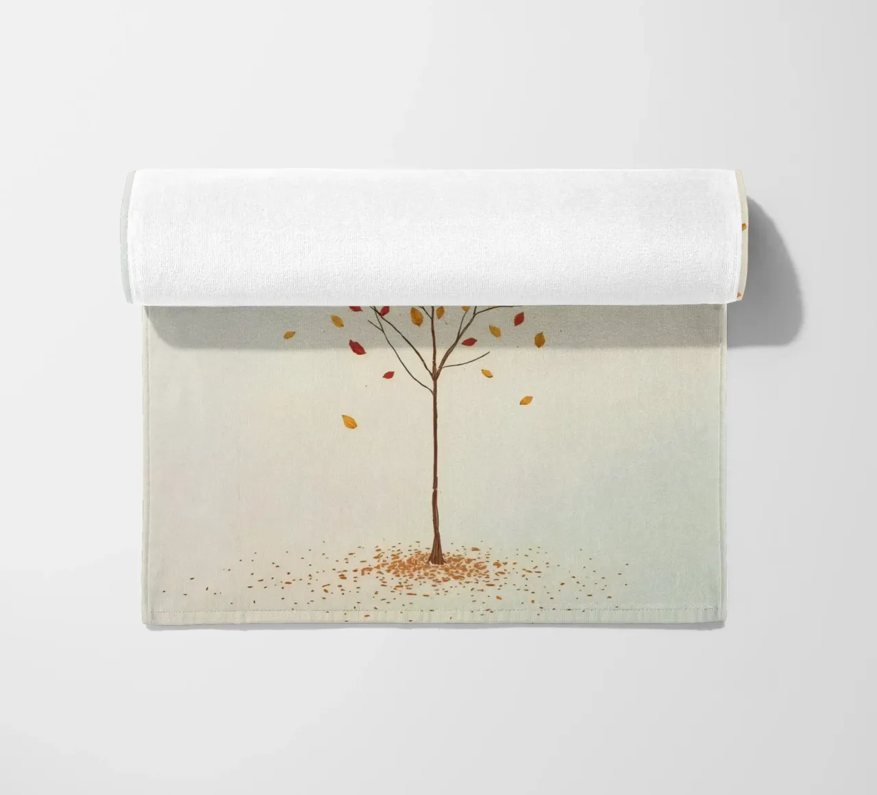 Tree shedding leaves in autumn depicting the seasonal change beach towel by DesignDoodle