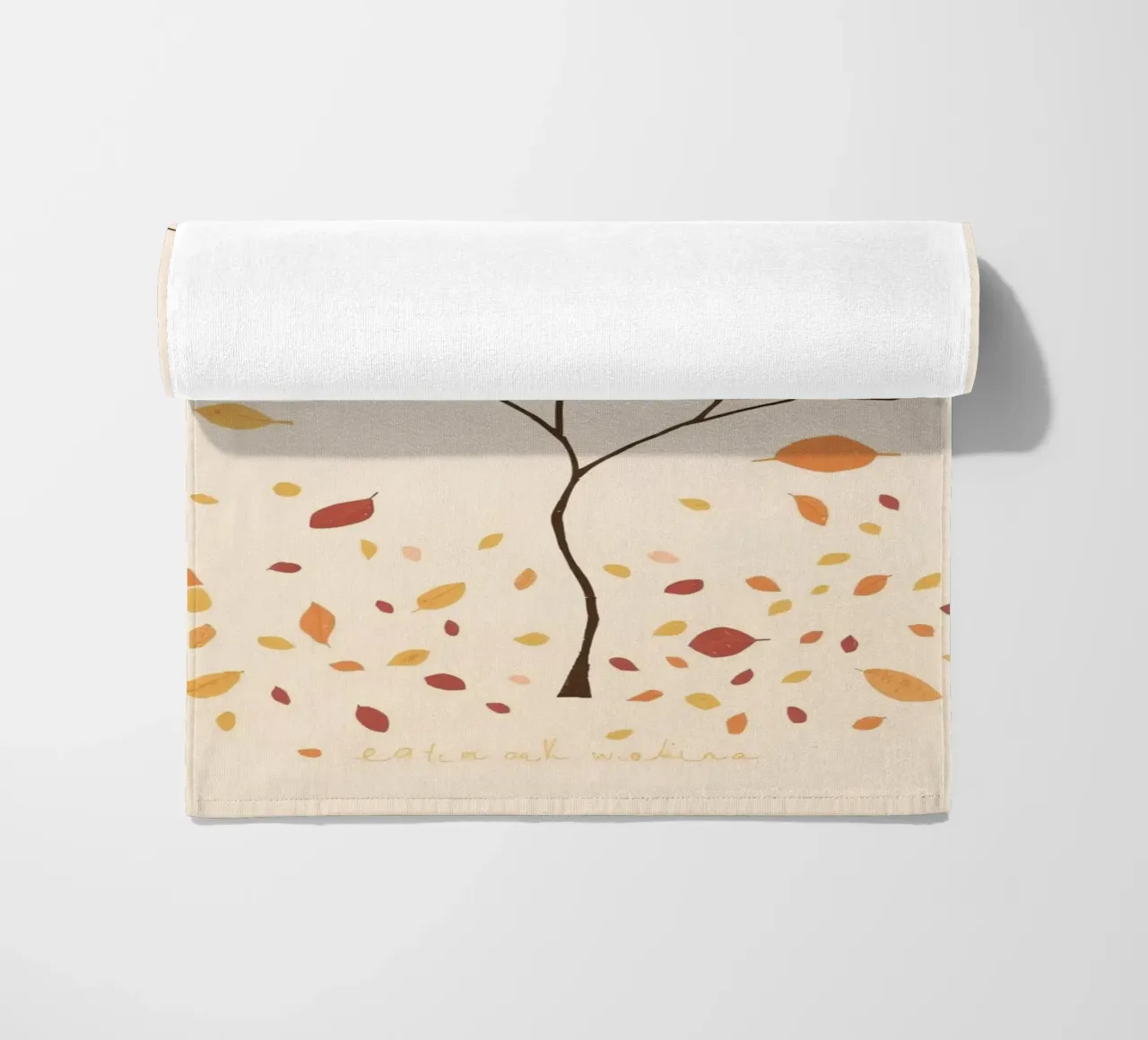 Bare tree surrounded by falling leaves in autumn season beach towel by DesignDoodle