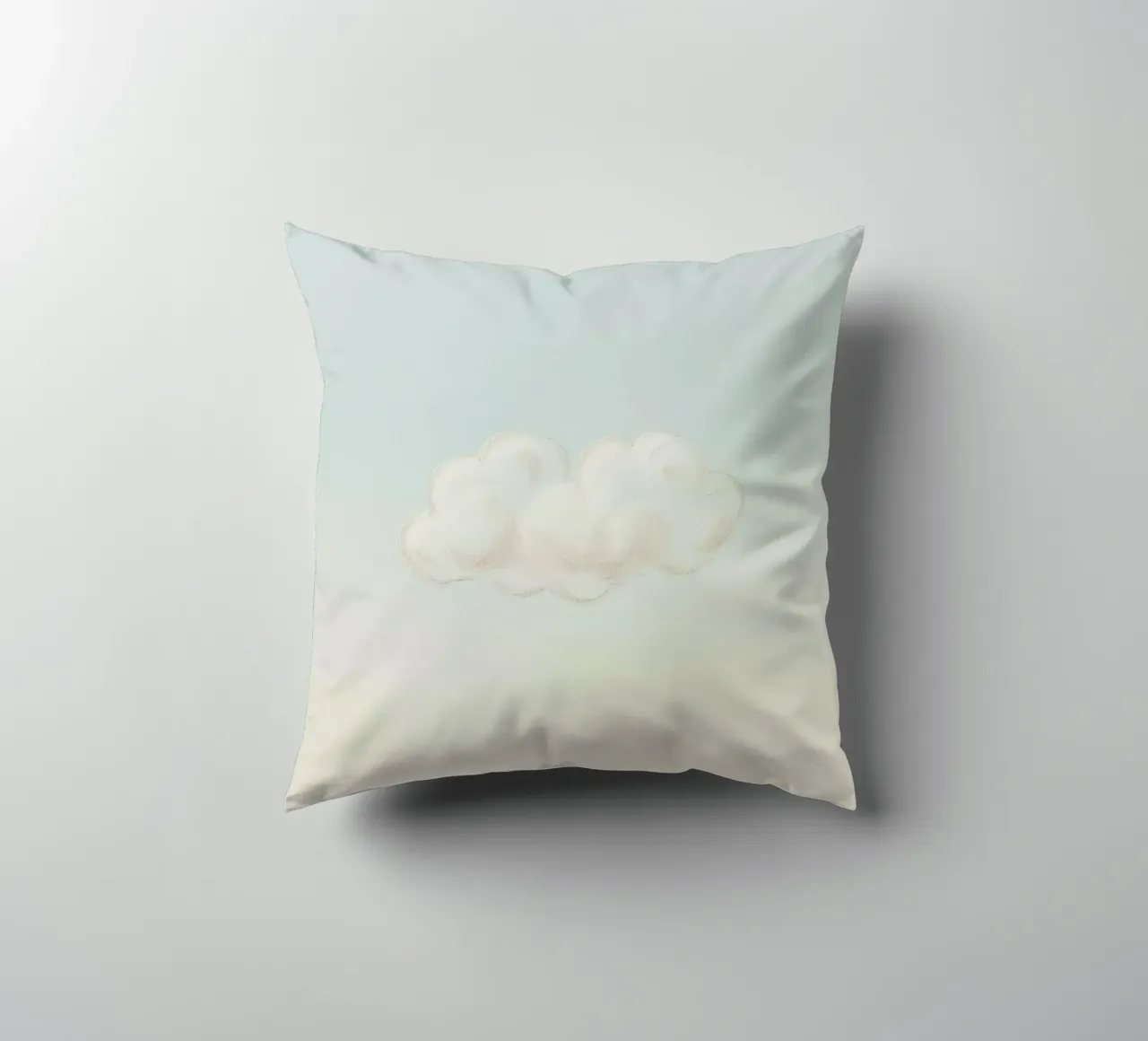 Una soffice nuvola bianca alla deriva in un cielo limpido sopra una terra serena cuscino da DesignDoodle
