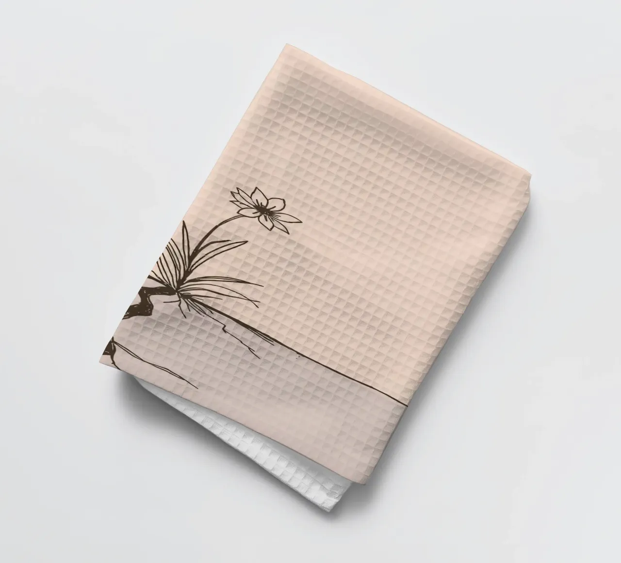 Fleur poussant à travers la terre craquelée dans un paysage désolé torchon de DesignDoodle