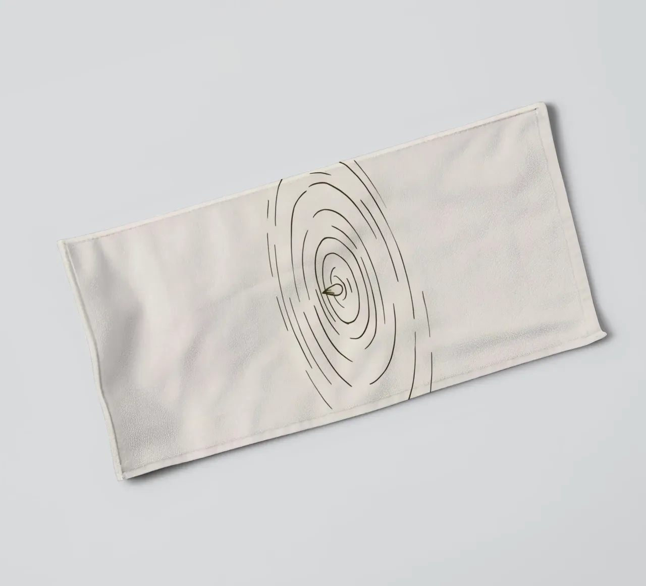 Ripples expanding in calm water created by a single drop towel by DesignDoodle