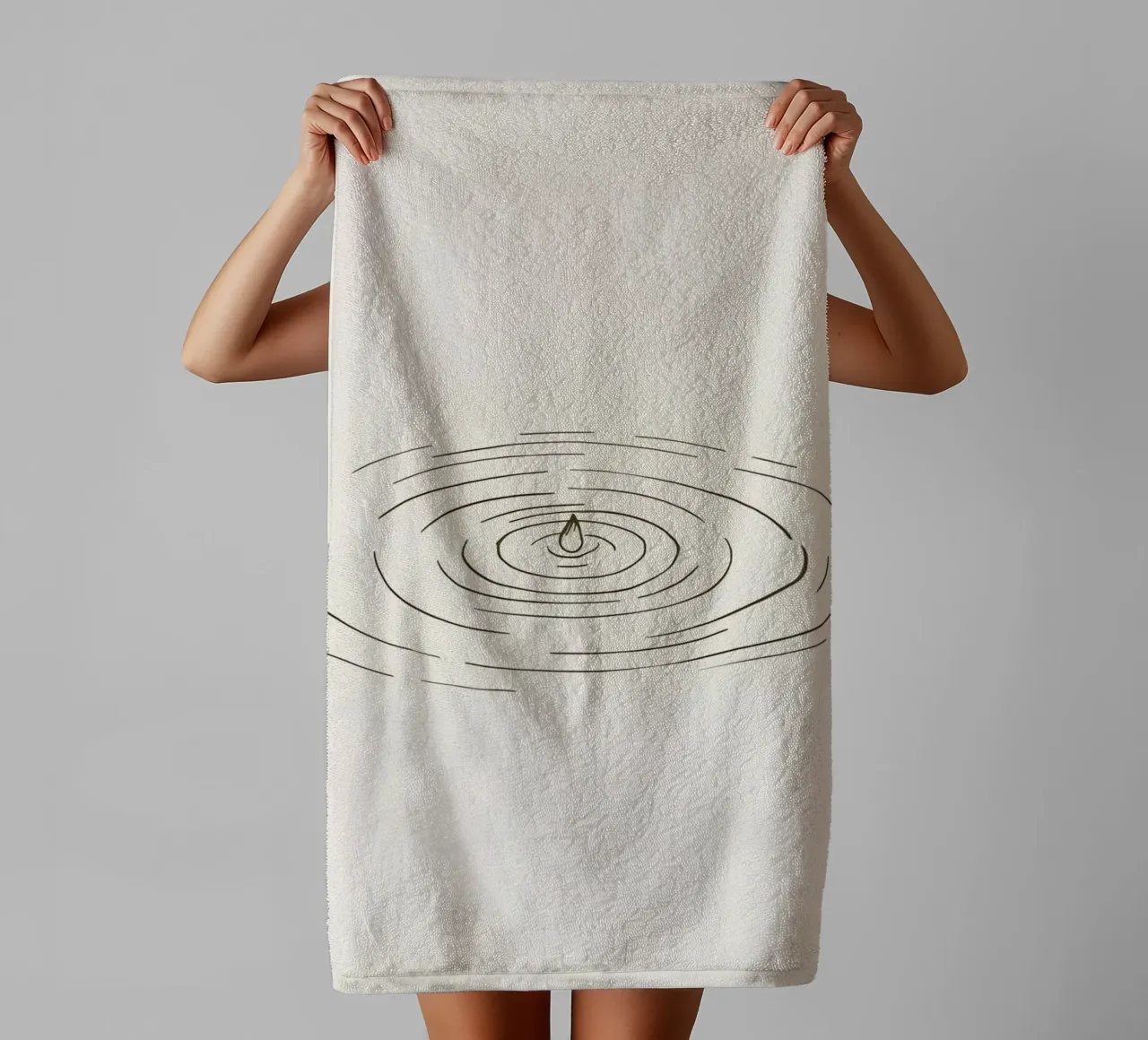 Ripples expanding in calm water created by a single drop towel by DesignDoodle