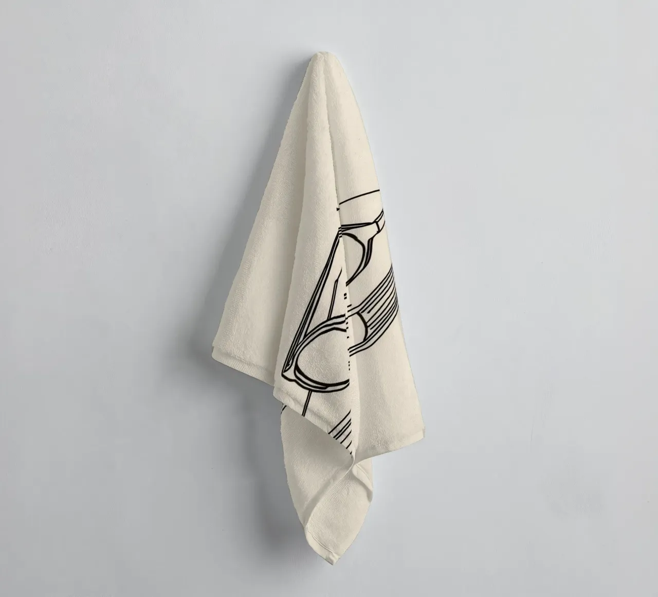 Glasses on a closed book symbolizing knowledge and reading towel by DesignDoodle