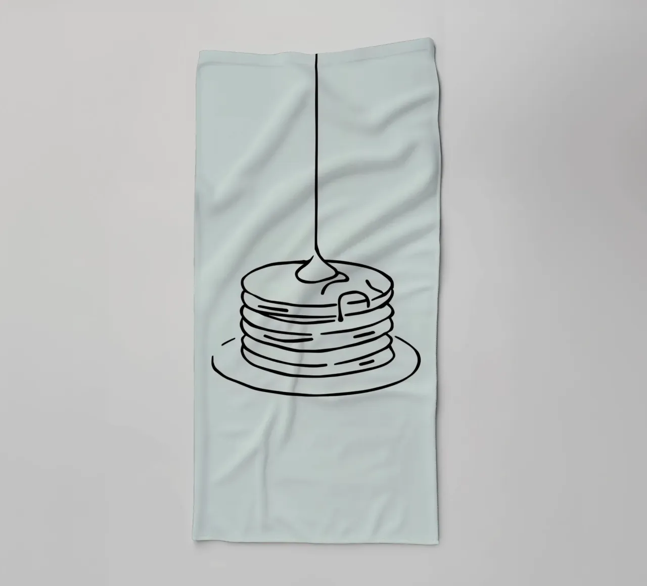 Stacked pancakes with syrup dripping on a green background towel by DesignDoodle