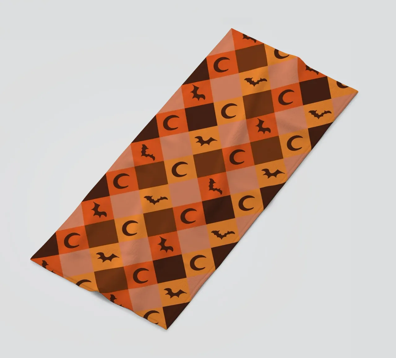 Pumpkin with plaid pattern bats and moon beach towel by gulsengunel