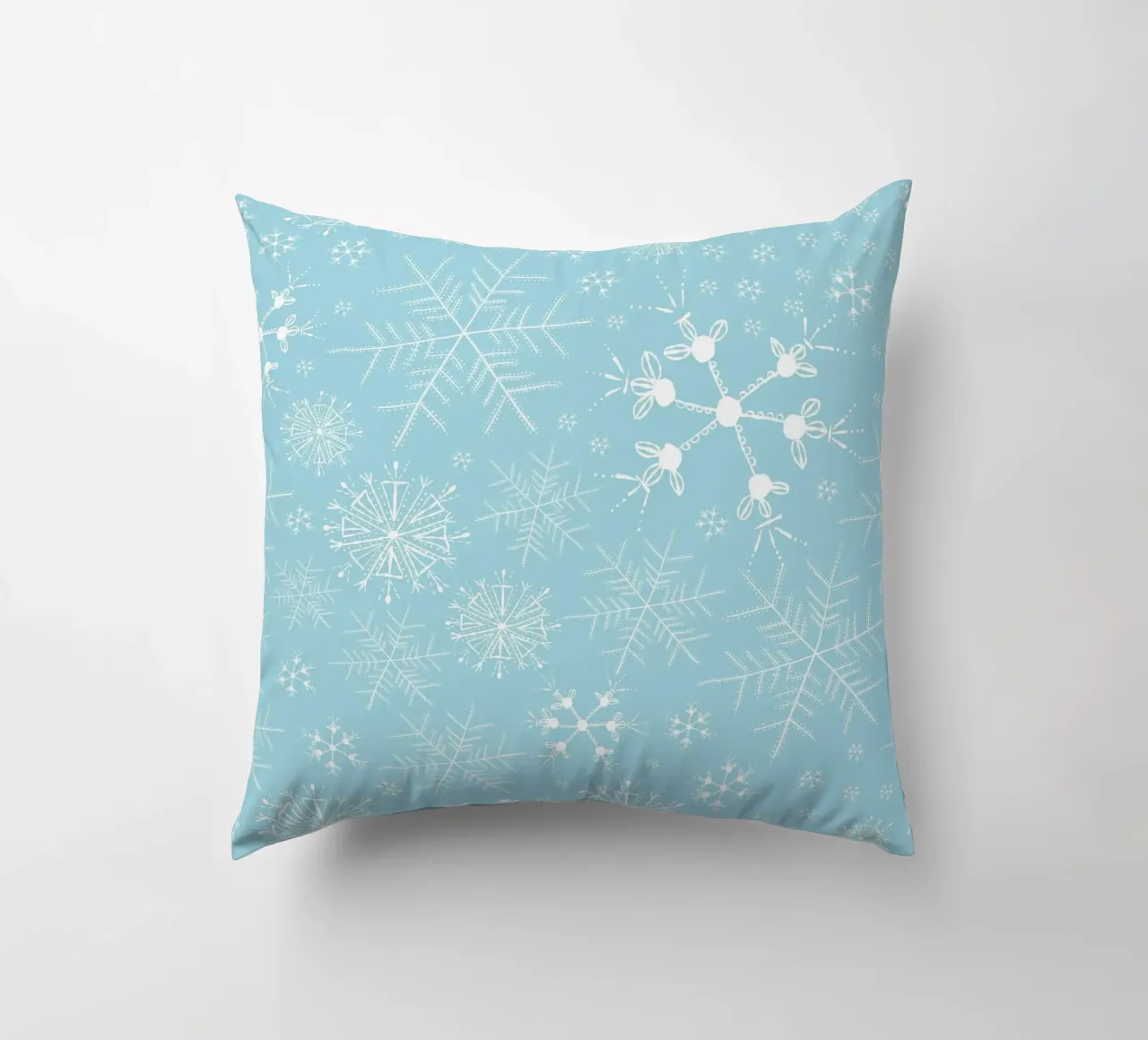 Flocons de neige blancs sur fond bleu coussin de gulsengunel
