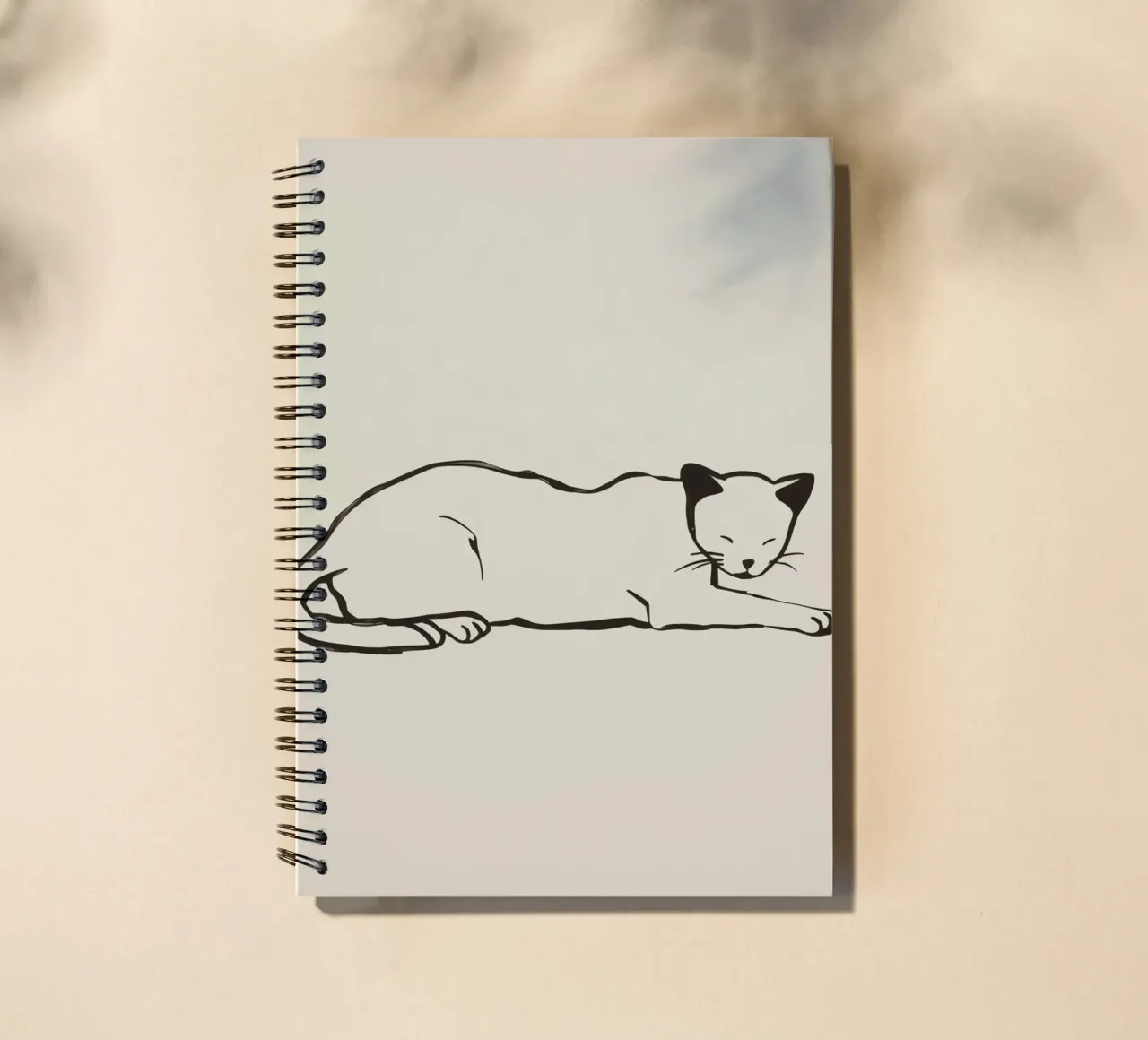 Relaxed cat resting comfortably with eyes closed spiral notebook by DesignDoodle