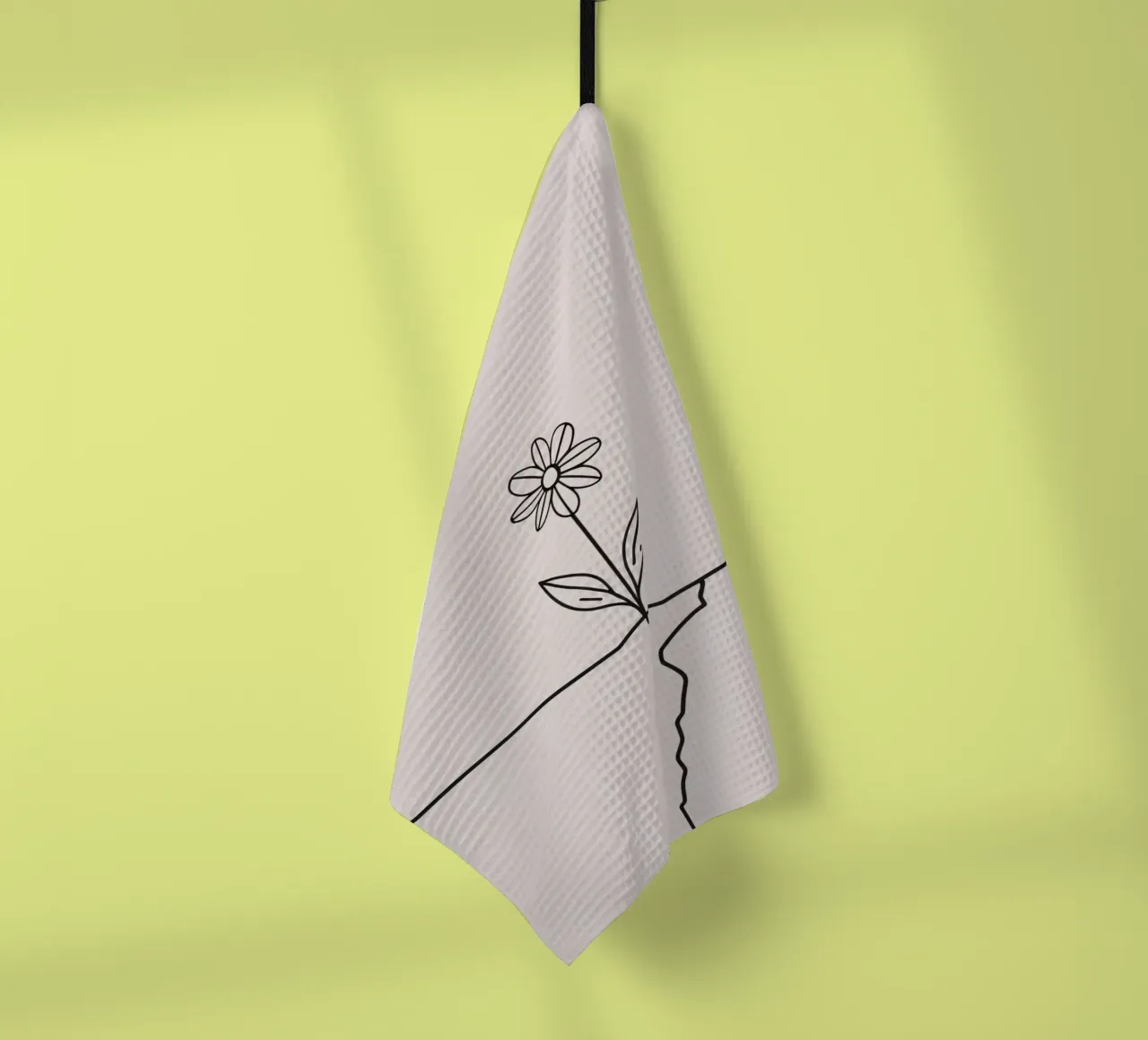La fleur qui pousse à partir d'une fissure dans la surface symbolise la résilience torchon de DesignDoodle