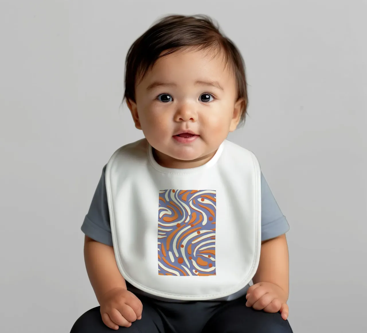 Groovy Orange Swirls baby bib by Veil Maya