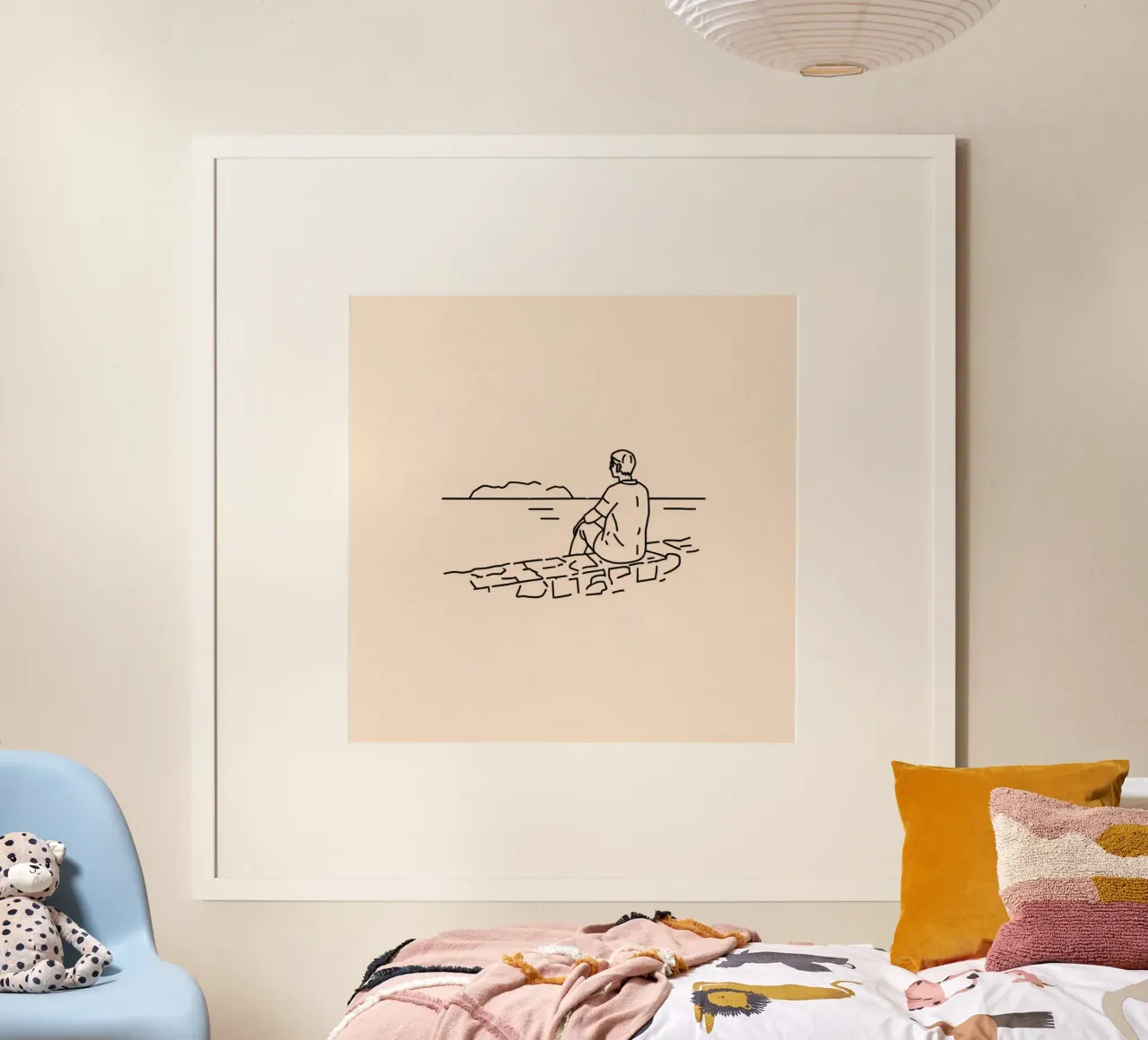 man reflects by the water while sitting on the shore hahnemühle by DesignDoodle