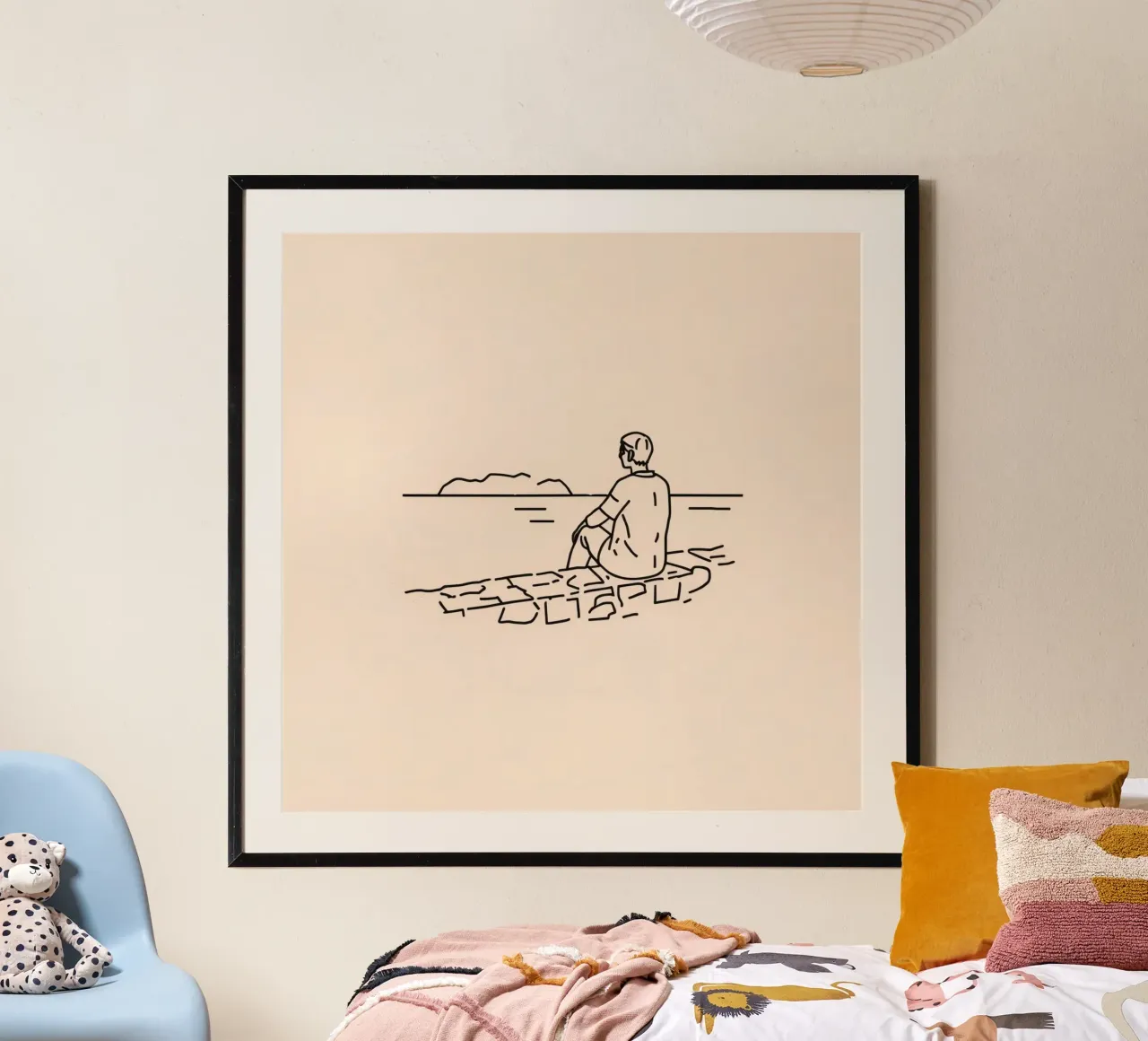 man reflects by the water while sitting on the shore hahnemühle by DesignDoodle