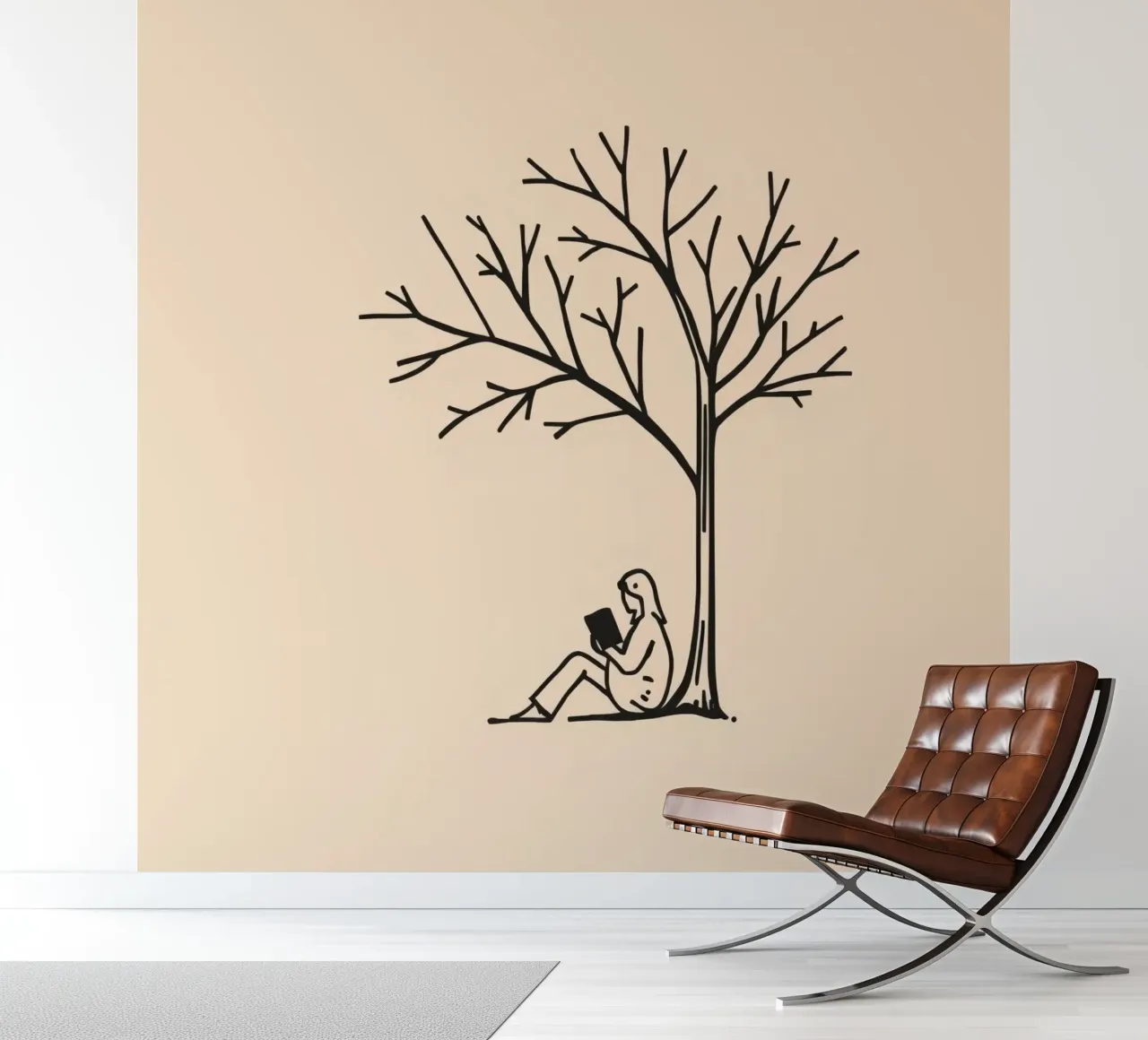 Person reading a book under a bare tree on a warm afternoon photo wallpaper by DesignDoodle