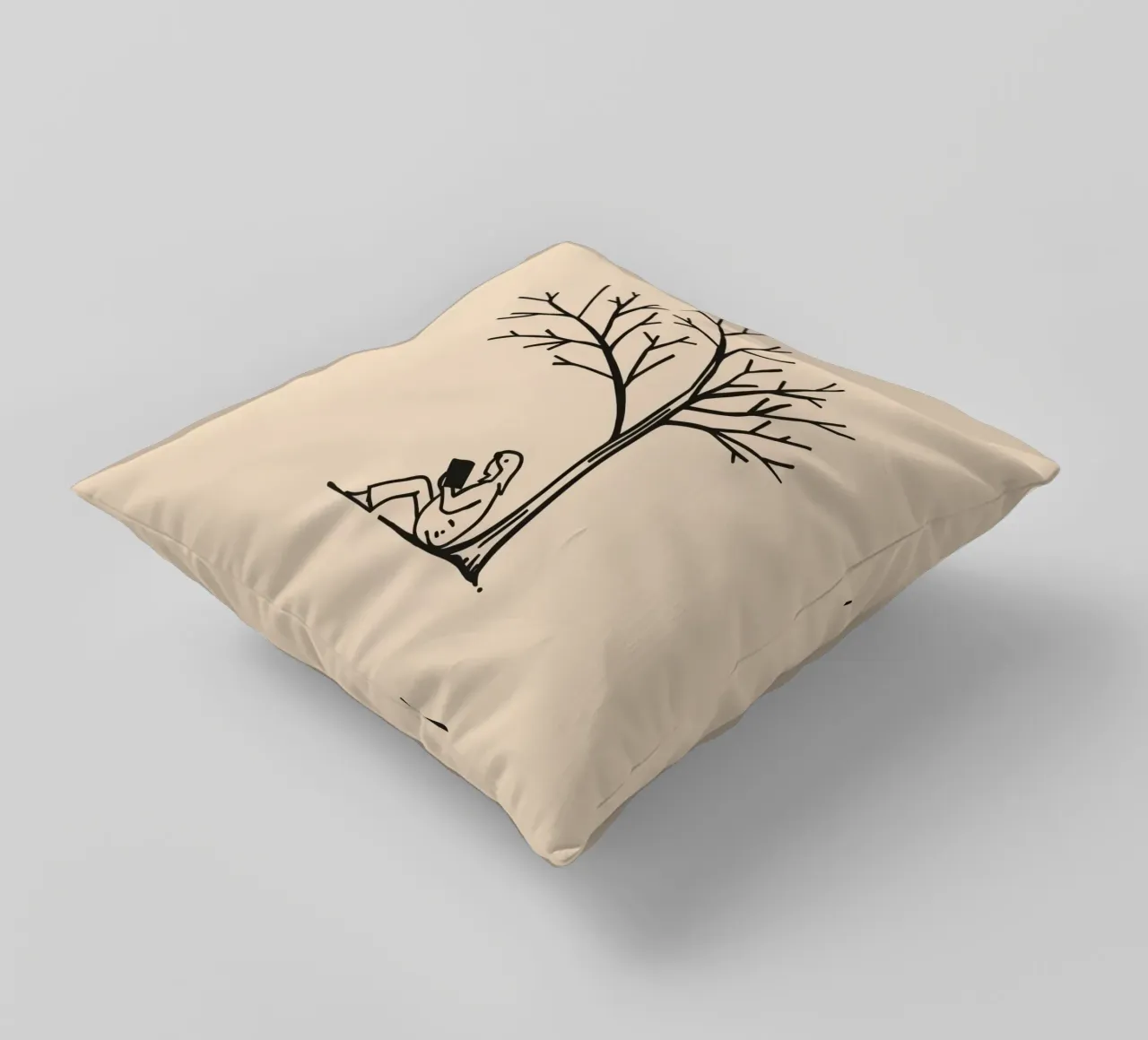 Persona che legge un libro sotto un albero spoglio in un pomeriggio caldo cuscino da DesignDoodle