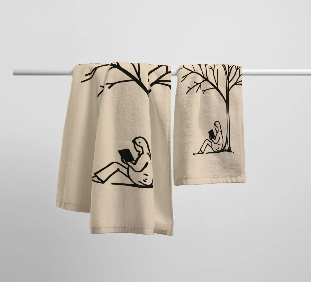 Person reading a book under a bare tree on a warm afternoon towel by DesignDoodle