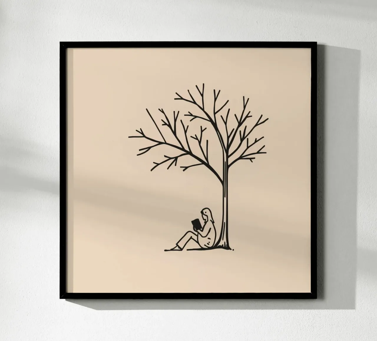 Person reading a book under a bare tree on a warm afternoon hahnemühle by DesignDoodle