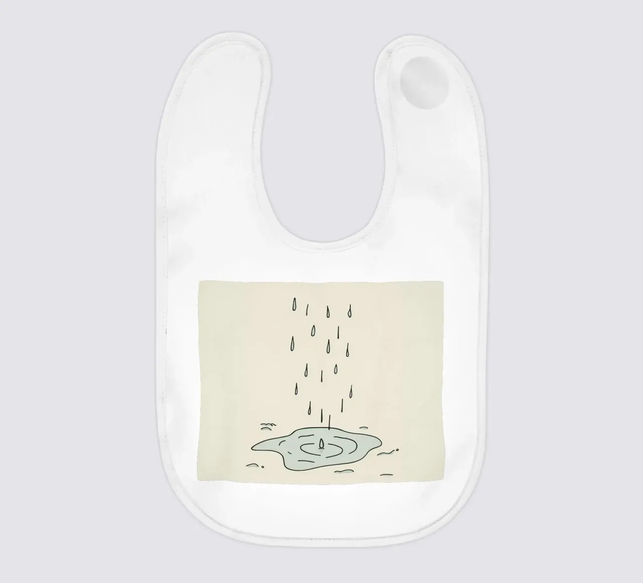 Gocce di acqua piovana che creano increspature in una piccola pozzanghera bavaglino da DesignDoodle