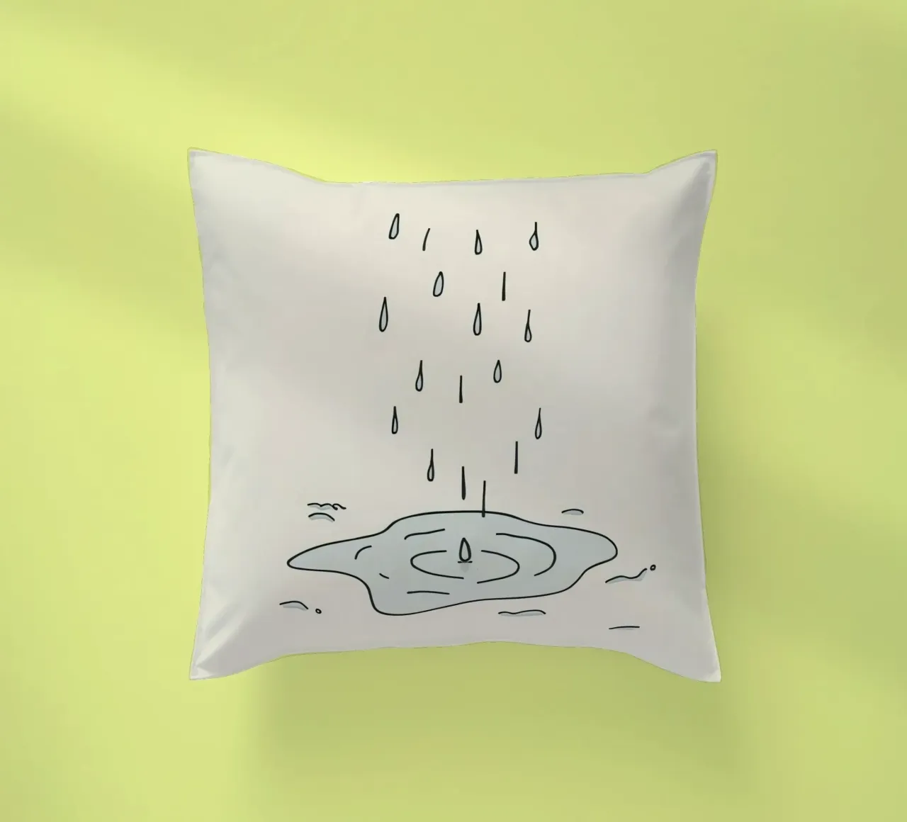 Gocce di acqua piovana che creano increspature in una piccola pozzanghera cuscino da DesignDoodle
