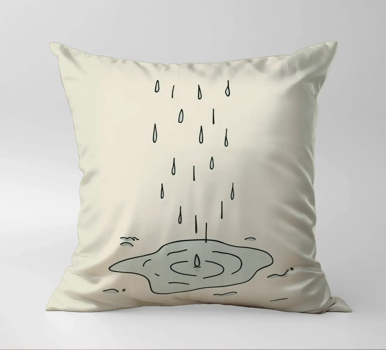Gocce di acqua piovana che creano increspature in una piccola pozzanghera cuscino da DesignDoodle