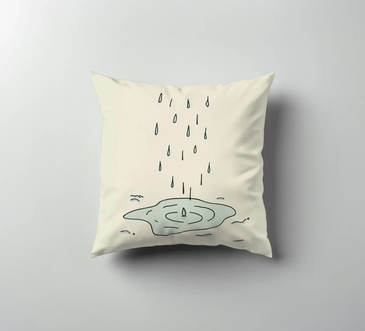 Gocce di acqua piovana che creano increspature in una piccola pozzanghera cuscino da DesignDoodle