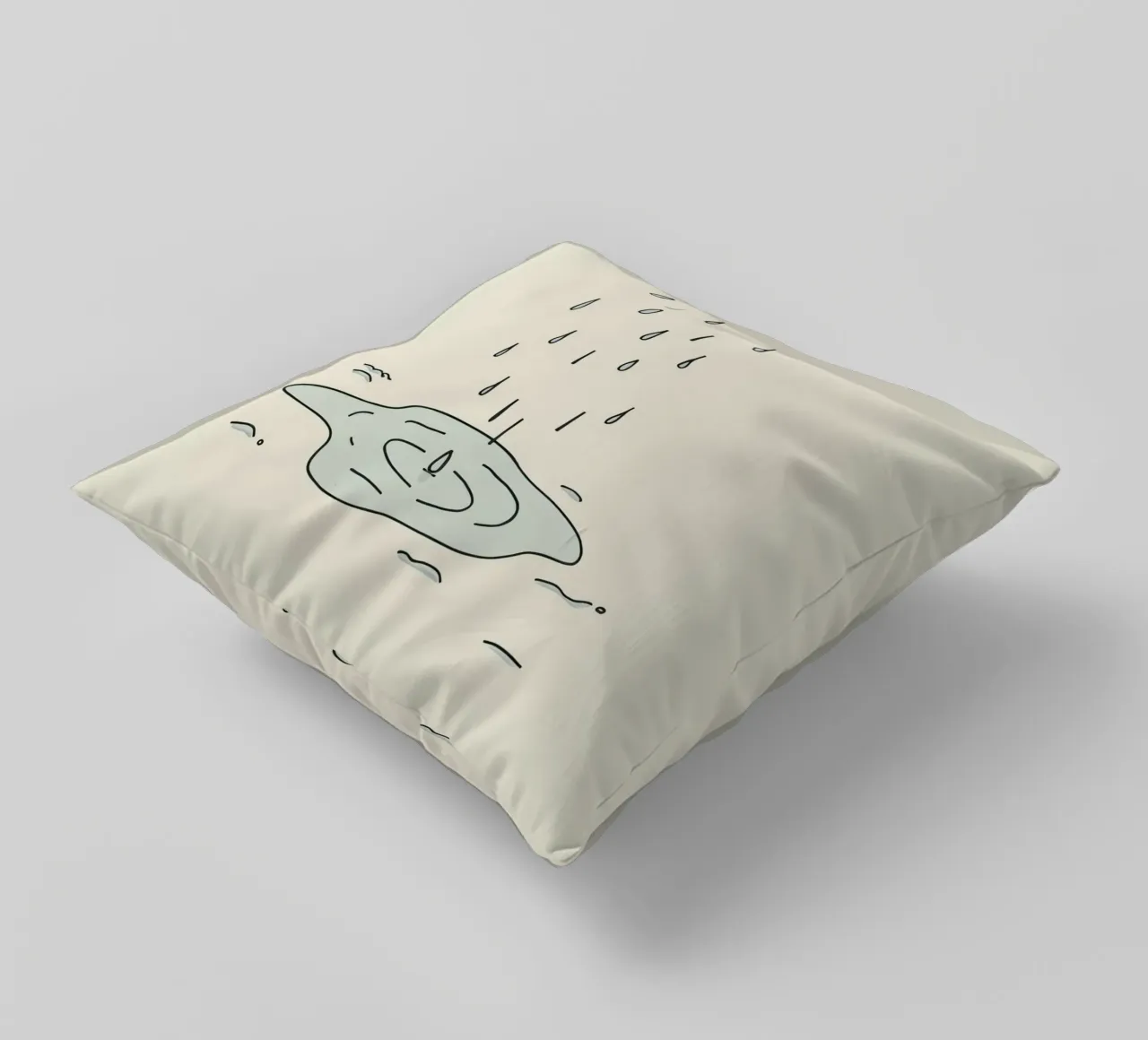 Gocce di acqua piovana che creano increspature in una piccola pozzanghera cuscino da DesignDoodle