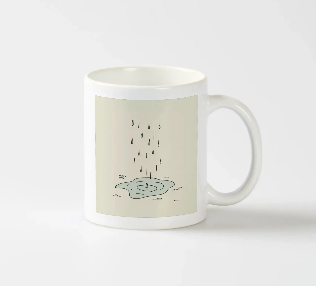 Gocce di acqua piovana che creano increspature in una piccola pozzanghera tazza in ceramica da DesignDoodle