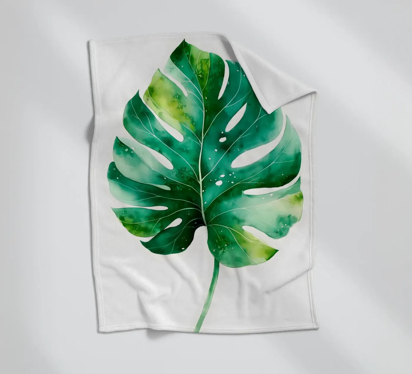 Monstera leaf fleece blanket by Studio Verde