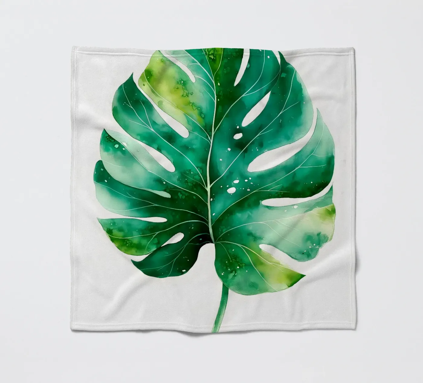 Monstera leaf fleece blanket by Studio Verde