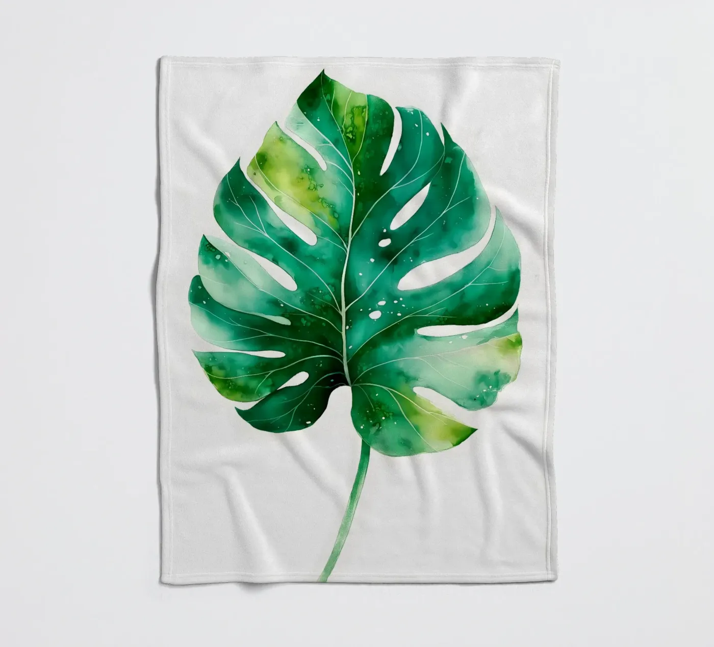 Monstera leaf fleece blanket by Studio Verde