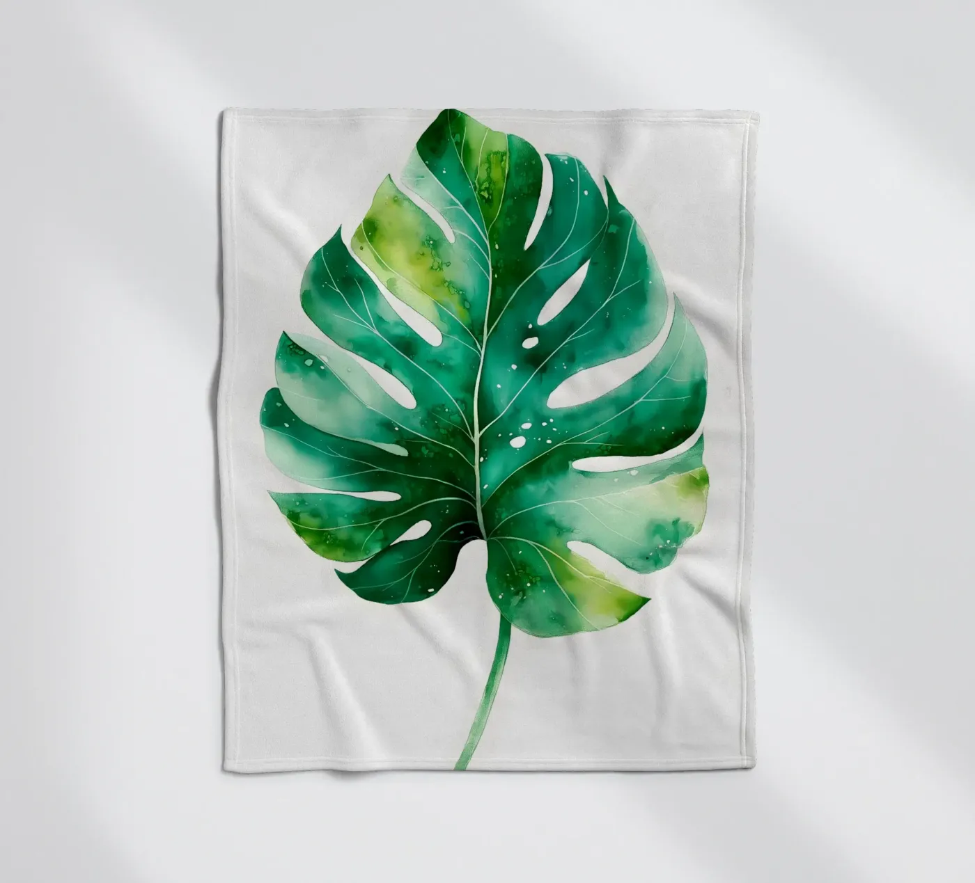 Monstera leaf fleece blanket by Studio Verde