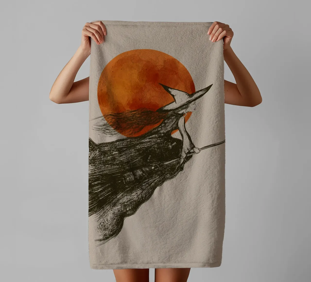 Flying witch with long hair in front of a red moon towel by Lisa Jureczko Arts Illustration