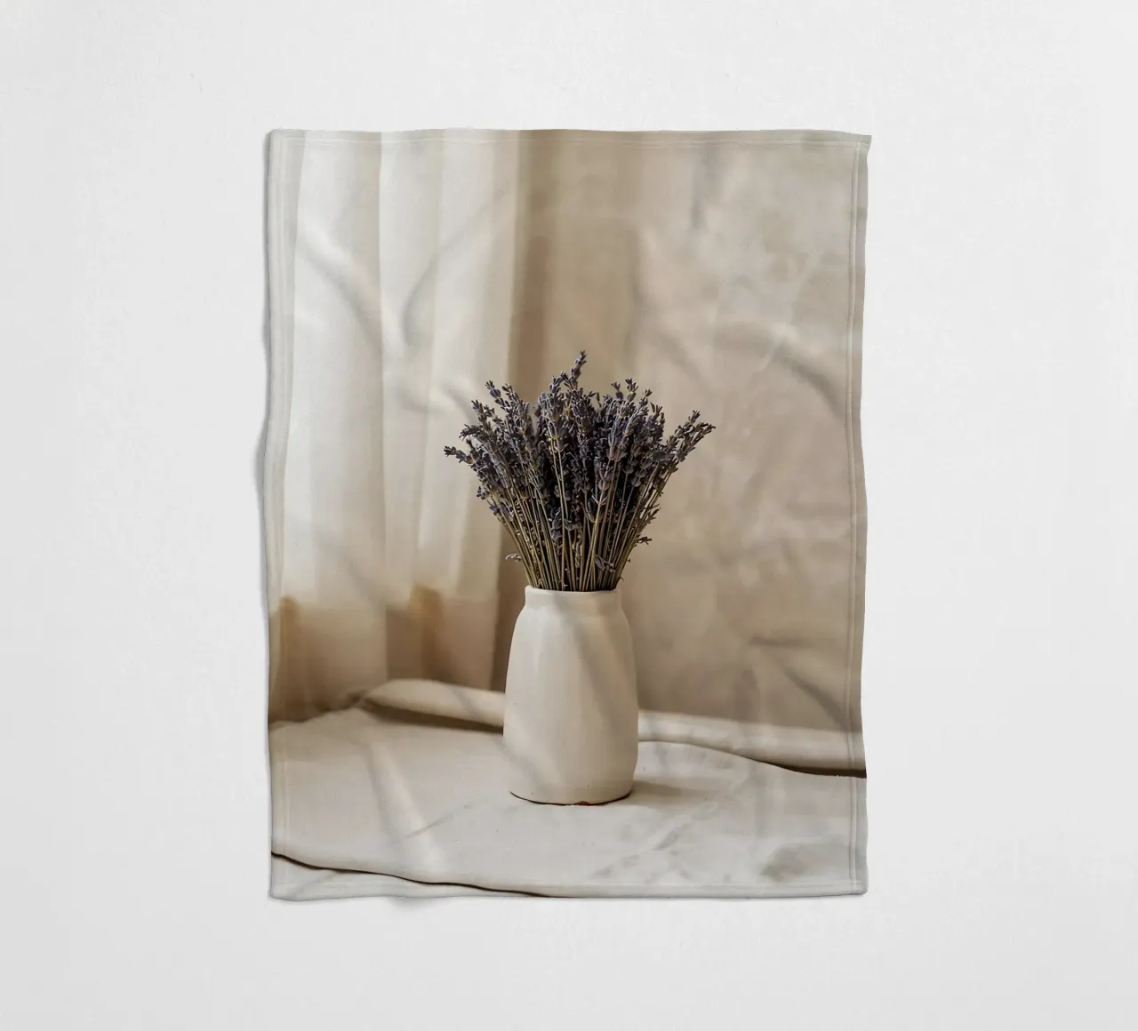 Bouquet of dried lavender in ceramic vase fleece blanket by Casa Limon