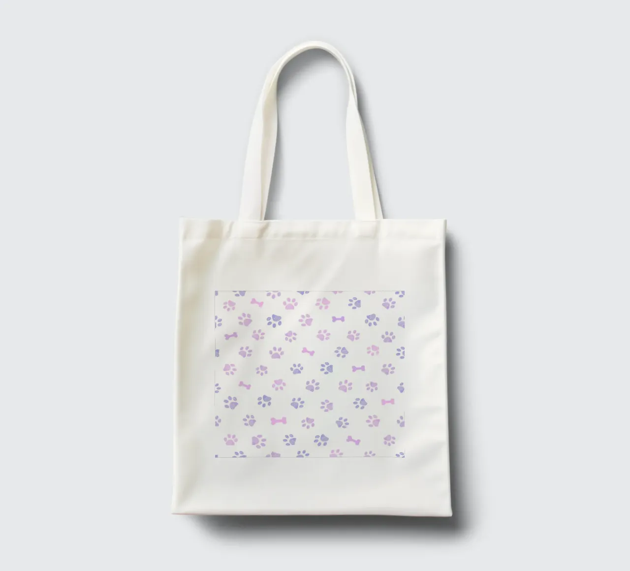 Lilac and pink colored doodles paw prints and bones tote bag by gulsengunel