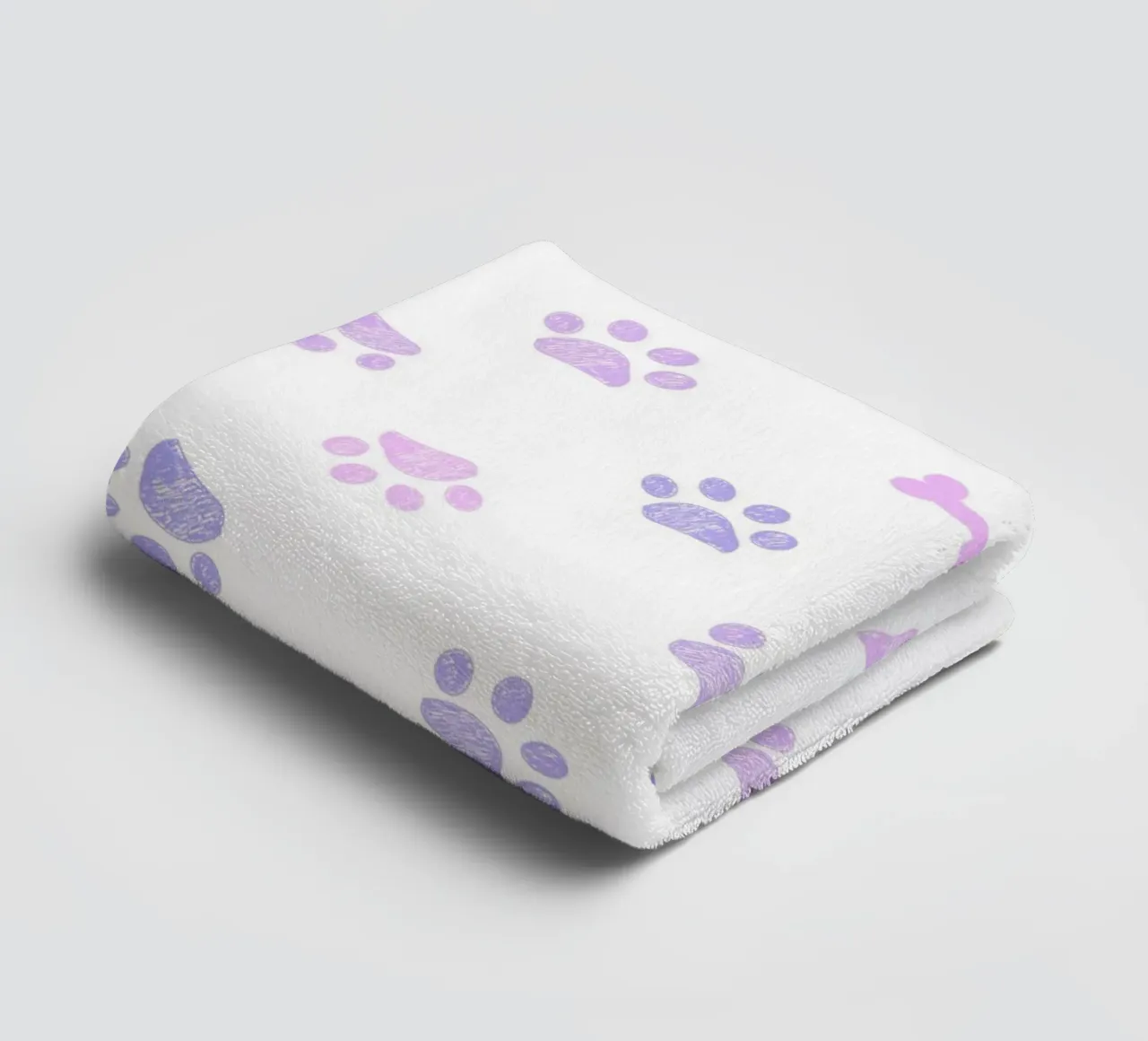 Lilac and pink colored doodles paw prints and bones towel by gulsengunel