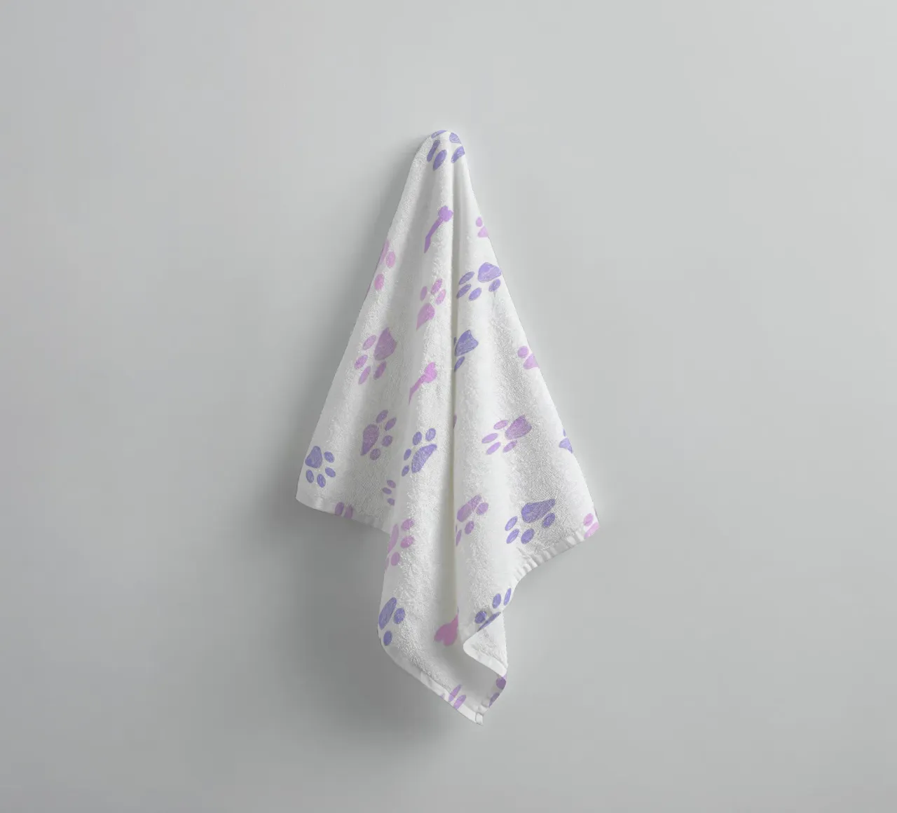 Lilac and pink colored doodles paw prints and bones towel by gulsengunel