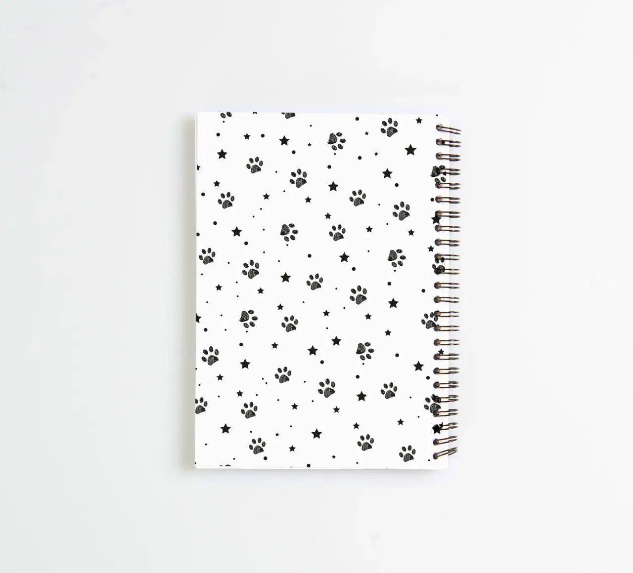 Seamless fabric pattern with paw and stars spiral notebook by gulsengunel