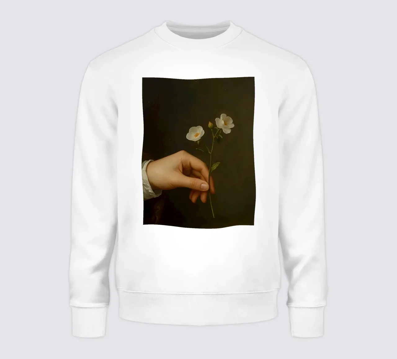 Mano che tiene in mano delicati fiori bianchi su uno sfondo scuro felpa da DesignDoodle
